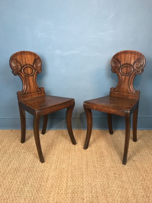 A Pair of Regency Mahogany  Sabre Leg Hall Chairs Circa 1820