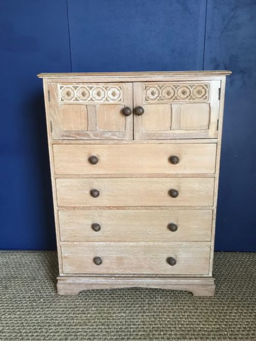 An Arts and Crafts  Limed Oak Tall Chest with Cupboard Circa 1930