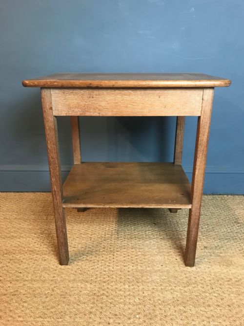 A Waring and Gillows Limed Oak 2 Tier Table Circa 1920