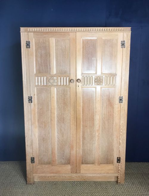 A 6 Piece Limed Oak Bedroom Suite by the Bath Cabinet Makers Company C 1930