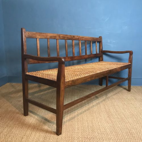 A South African Stink Wood and Rattan Seated Sofa Circa 1910 in Excellent Solid Condition.