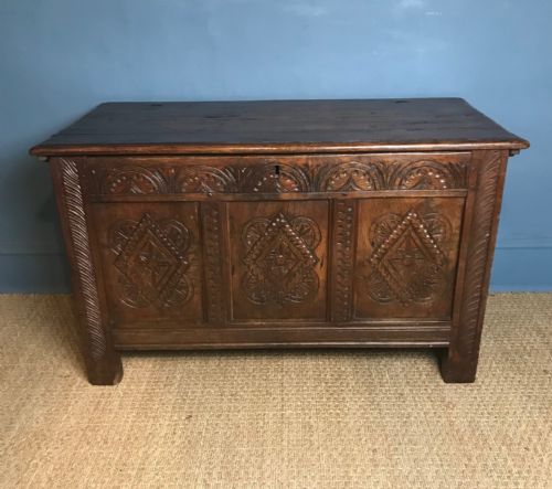 A Late 17th C West Country Carved Oak Coffer of Small Size .