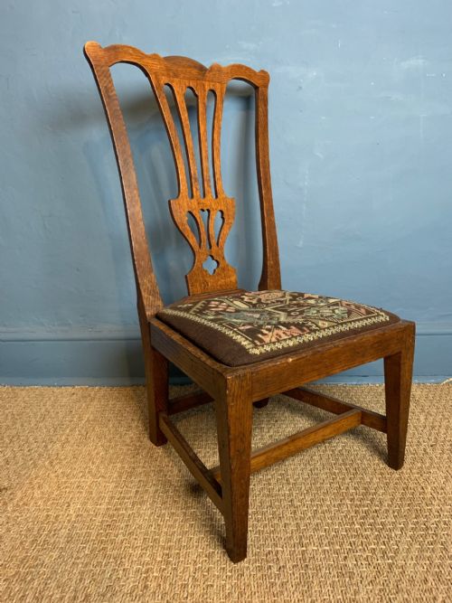 A Scottish Oak Low Chair by Wheeler of Arncroach Circa 1910