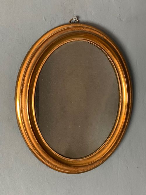 A Small Mid 19th C Gilt Brass Oval Mirror with Original Sparkly Plate.
