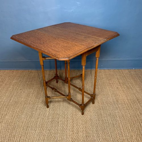 An Arts and Crafts Honey Oak Small Drop Flap Table Circa 1910