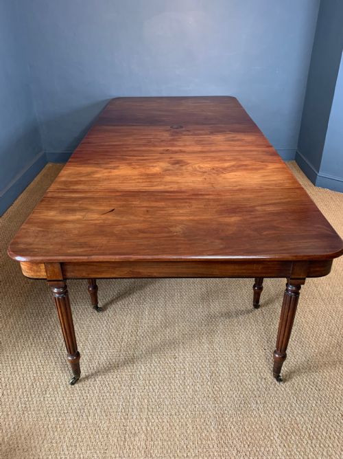 A Superb George IV Mahogany and Ebony Strung Extending Dining Table Circa 1820