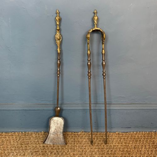 A Pair of Victorian Gothic Gilt Brass and Steel Fire Irons Circa 1870.
