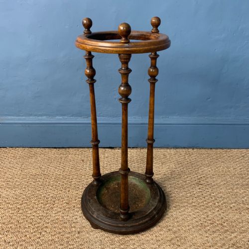 A Victorian Walnut and Cast Iron Circular Stick Stand Circa 1890