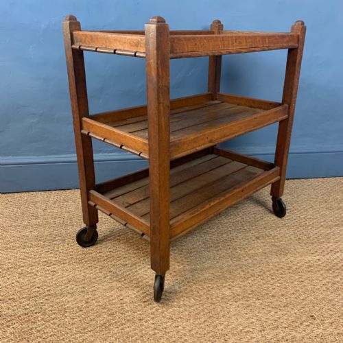 A 1920'S Oak Trolley with Slatted Shelves on Three Tiers .