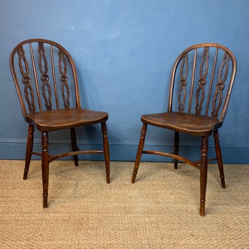 A Pair of Early 19th C Yew Wood Windsor Chairs .
