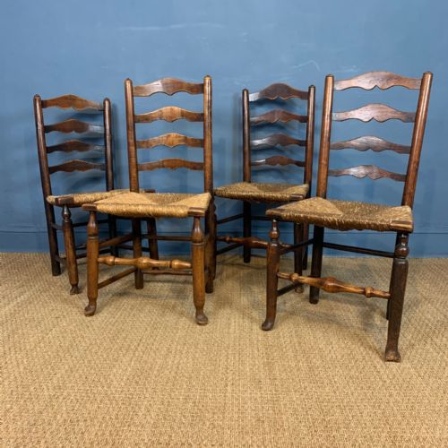 A Harlequin Set of Four Late 18th Century Cheshire Ladderback Chairs