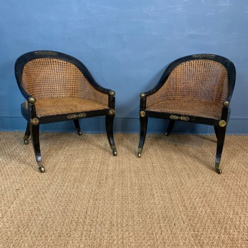 A Rare Pair of Regency Ebonised and Cane Low Bergere Chairs Circa 1815