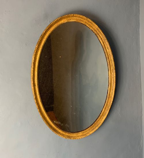 A George 111 Carved Gilt Oval Mirror Circa 1790