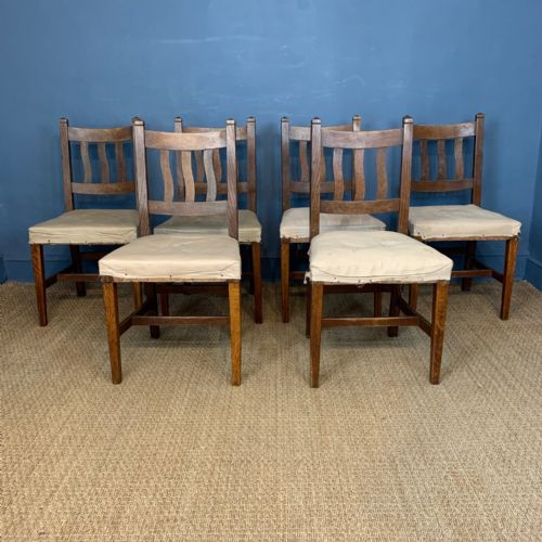 A Set of Six Arts and Crafts Oak Dining Chairs Circa 1900 in the Style of Cfa Voysey