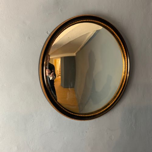 An Edwardian Ebonised and Gilt Circular Convex Mirror C 1905