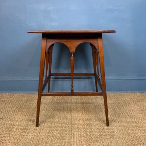 An Aesthetic Movement Walnut Table in the Style of Morris and Co