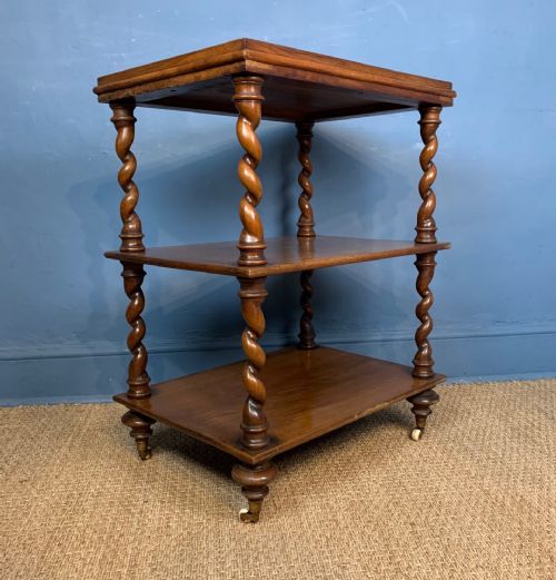 A Mid19th Century Walnut Three-tiered Table
