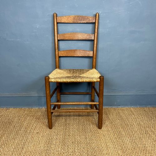 A Cotswold School Oak Clisset Type  Chair Circa 1910