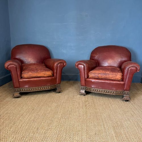 A Pair of English Red Leather and Oak Armchairs Circa 1920