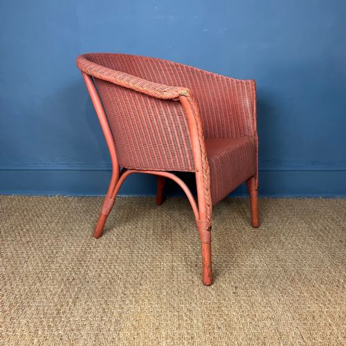 A Lloyd Loom Armchair Circa 1930 in the Original Pink Paint.