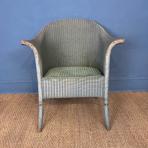 A 1930'S Lloyd Loom Wicker Armchair in the Original Teal Blue Paint.