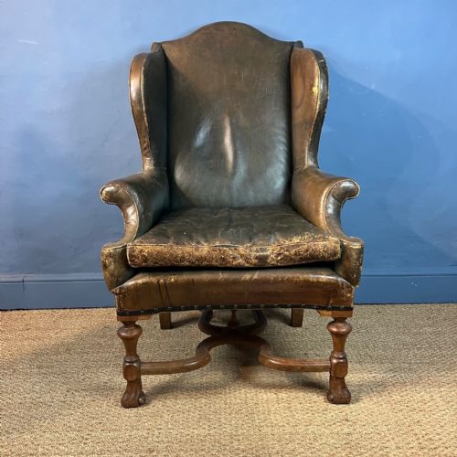 A Scottish Oak and Leather Wing Armchair Circa 1910