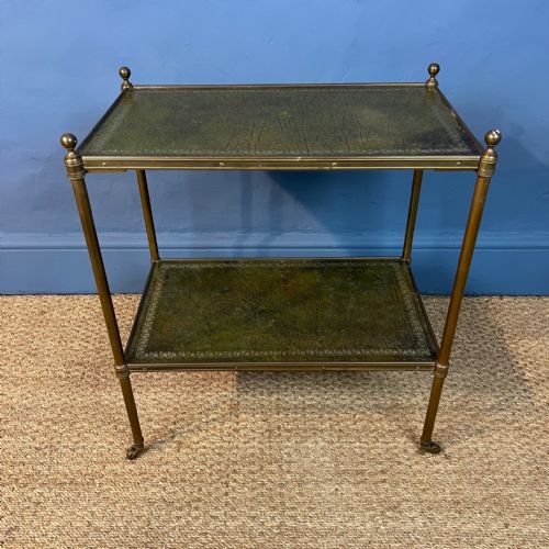 A 1920s Leather and Brass Two-tier Table on Turned Legs and Castors