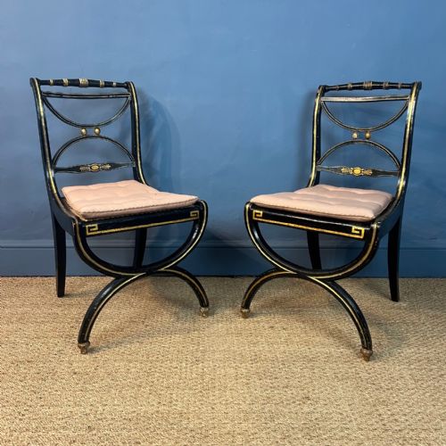 A Pair of Regency X Frame Ebonised and Parcel Gilt Side Chairs Circa 1815
