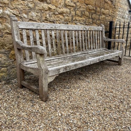 An Unusually Long Heals Type Teak Garden Bench Circa 1930