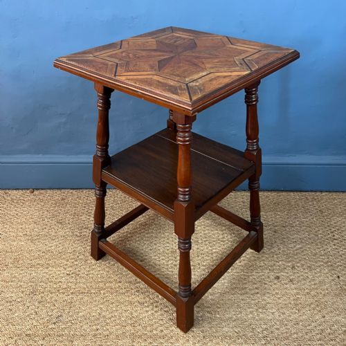 An Arts and Crafts Walnut and Parquetry 2 Tier Table Circa 1900