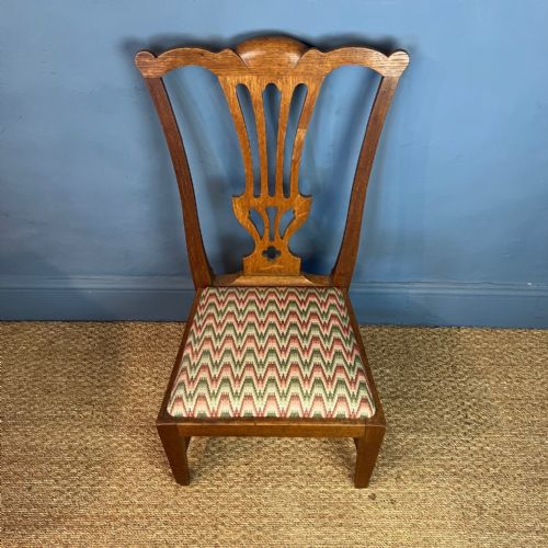 AN EARLY 20TH CENTURY OAK GOSSIP CHAIR BY WHEELERS OF ARNCROACH CIRCA 1910 - ADDITIONAL PHOTO 1