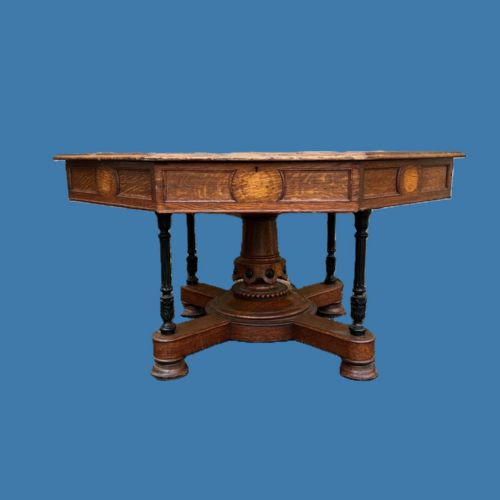 A GOTHIC REFORM OAK OCTAGONAL LIBRARY TABLE CIRCA 1860