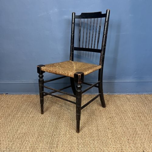 A William Morris Ebonised Beech Sussex Armchair to a Design by Philip Webb Circa 1880