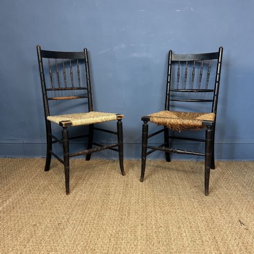 A Pair of William Morris Ebonised Beech Sussex Armchairs to a Design by Philip Webb Circa 1880