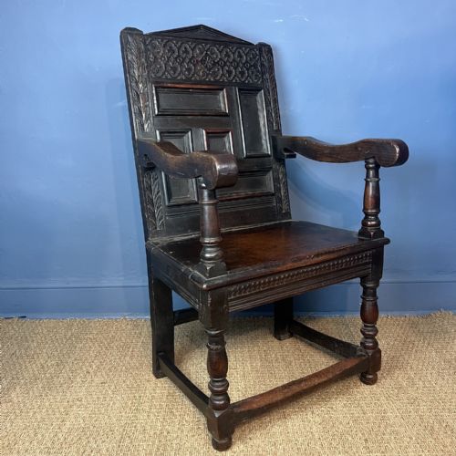 A CHARLES 11 CARVED OAK ARMCHAIR WEST COUNTRY CIRCA 1660