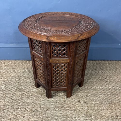AN INDIAN CIRCULAR TEAK AND BRASS INLAID TABLE CIRCA 1930