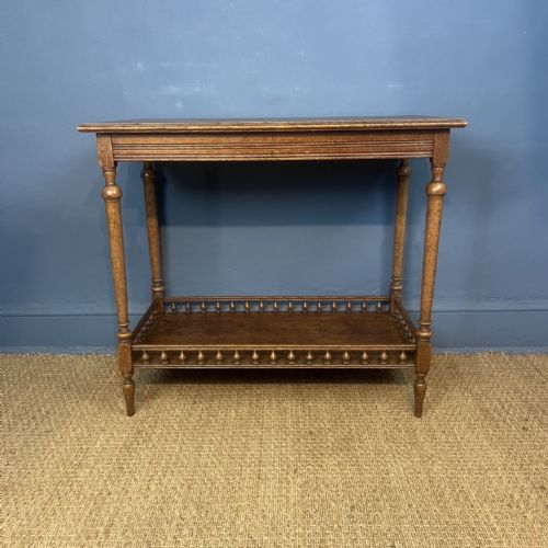 AN AESTHETIC MOVEMENT OAK TWO TIER RECTANGULAR TABLE CIRCA 1880