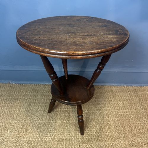AN UNUSUAL ARTS AND CRAFTS OAK CIRCULAR 2 TIER CRICKET TABLE CIRCA 1900