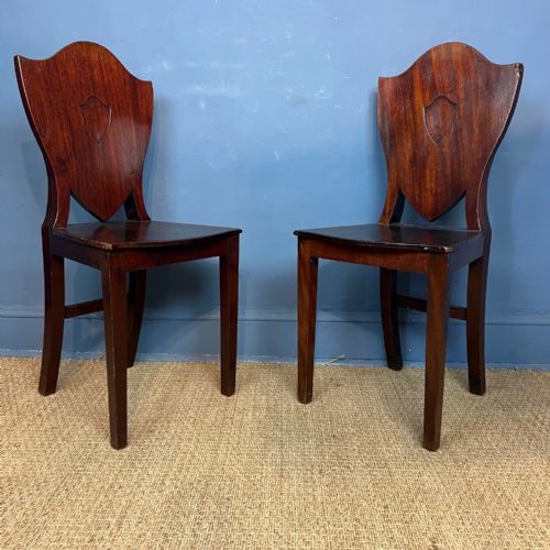 A Pair of George 111 Mahogany Shield Back Hall Chairs Circa 1790