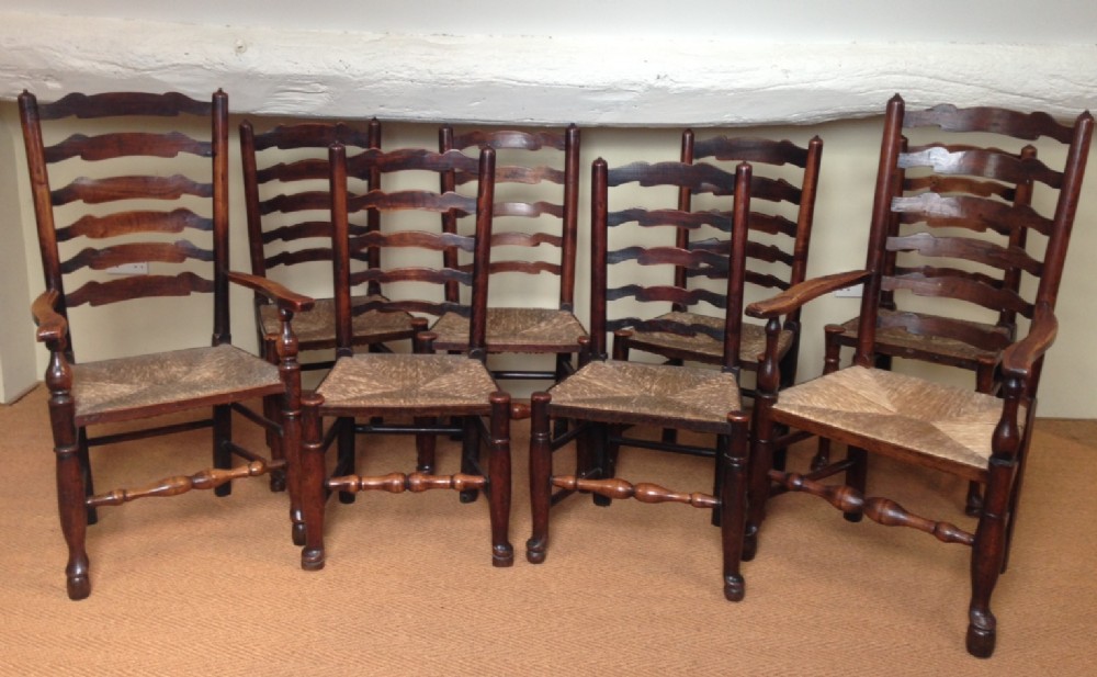 A good harlequin set of 8 late 18th c Ash North Country ladderback chairs c 1800