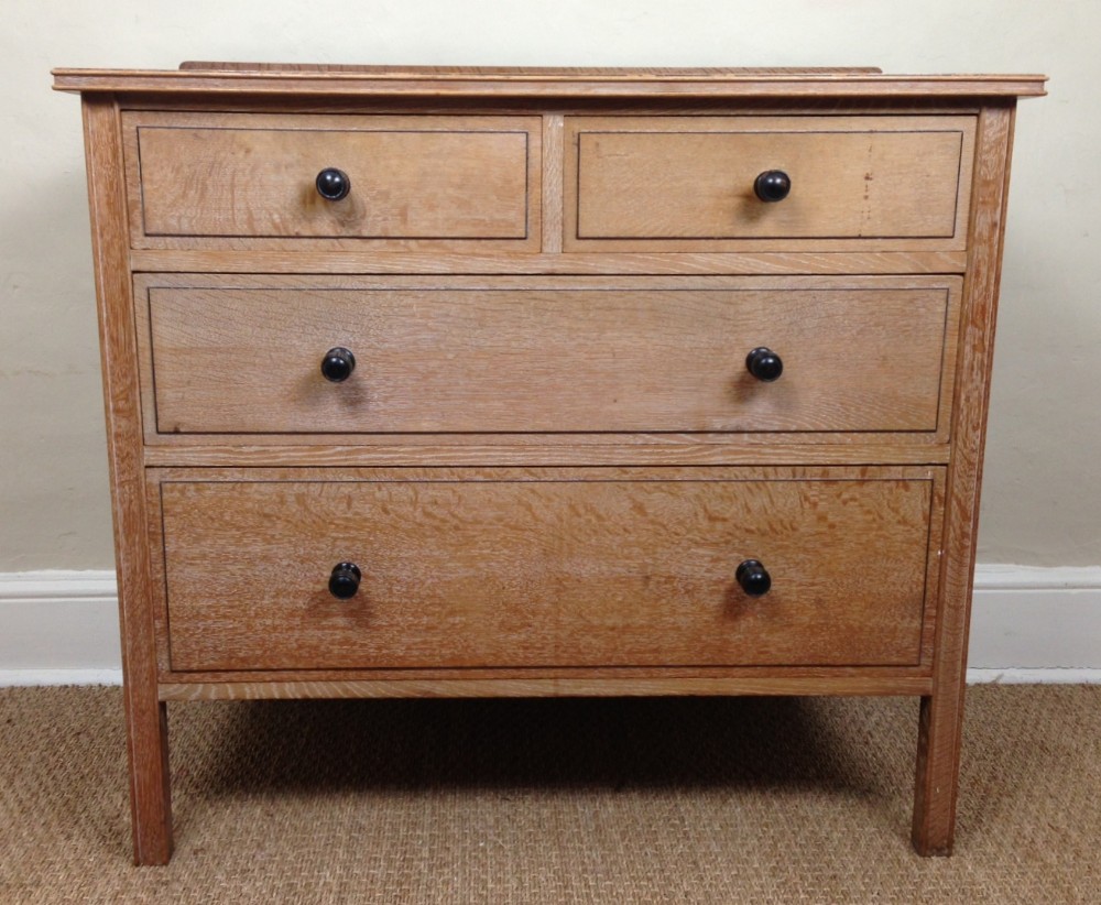 A fine Heals oak and ebony strung chest c 1920