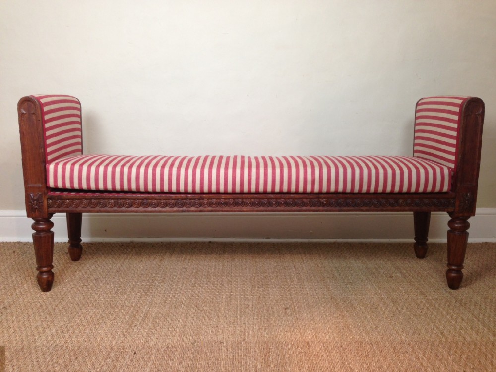 A large George IV Gothic oak window or hall seat c 1830