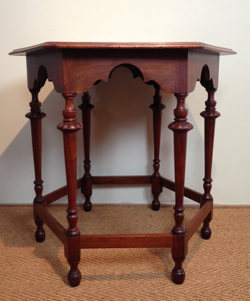 An Edwardian walnut lamp table attributed to Wylie and Lochhead c 1910