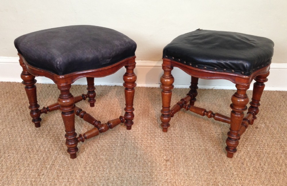 A pair of Victorian walnut stools c 1860 