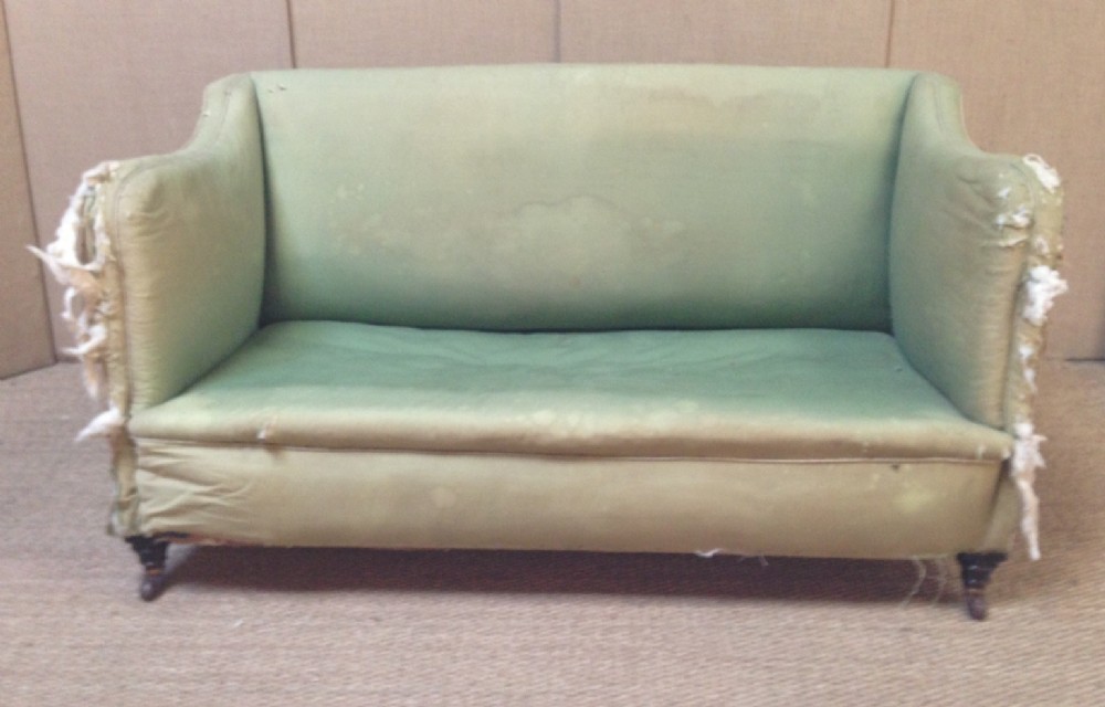 A late Victorian mahogany sofa for re upholstery c 1900