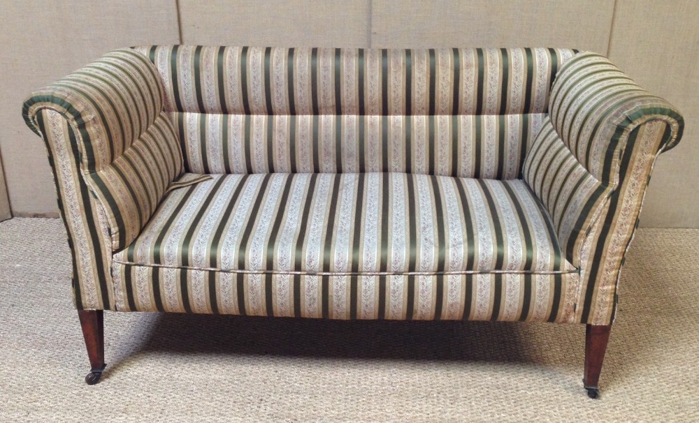 An Edwardian double drop flap sofa by Smith of Bristol dated 1915