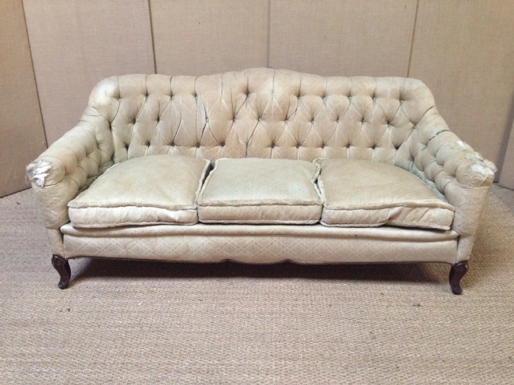 A Victorian button back cabriole leg sofa c 1880