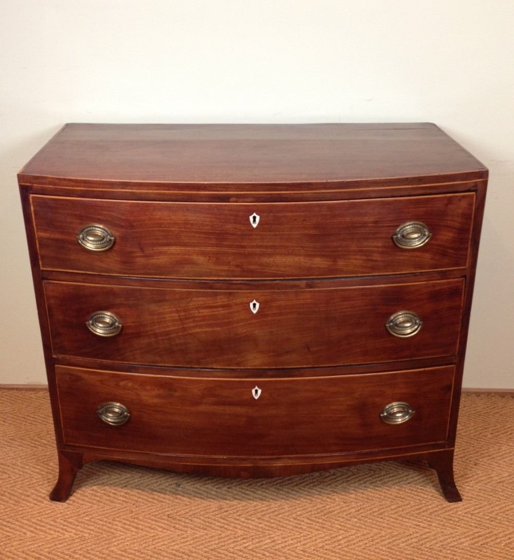 A George 111 mahogany bowfront chest of drawers c 1810