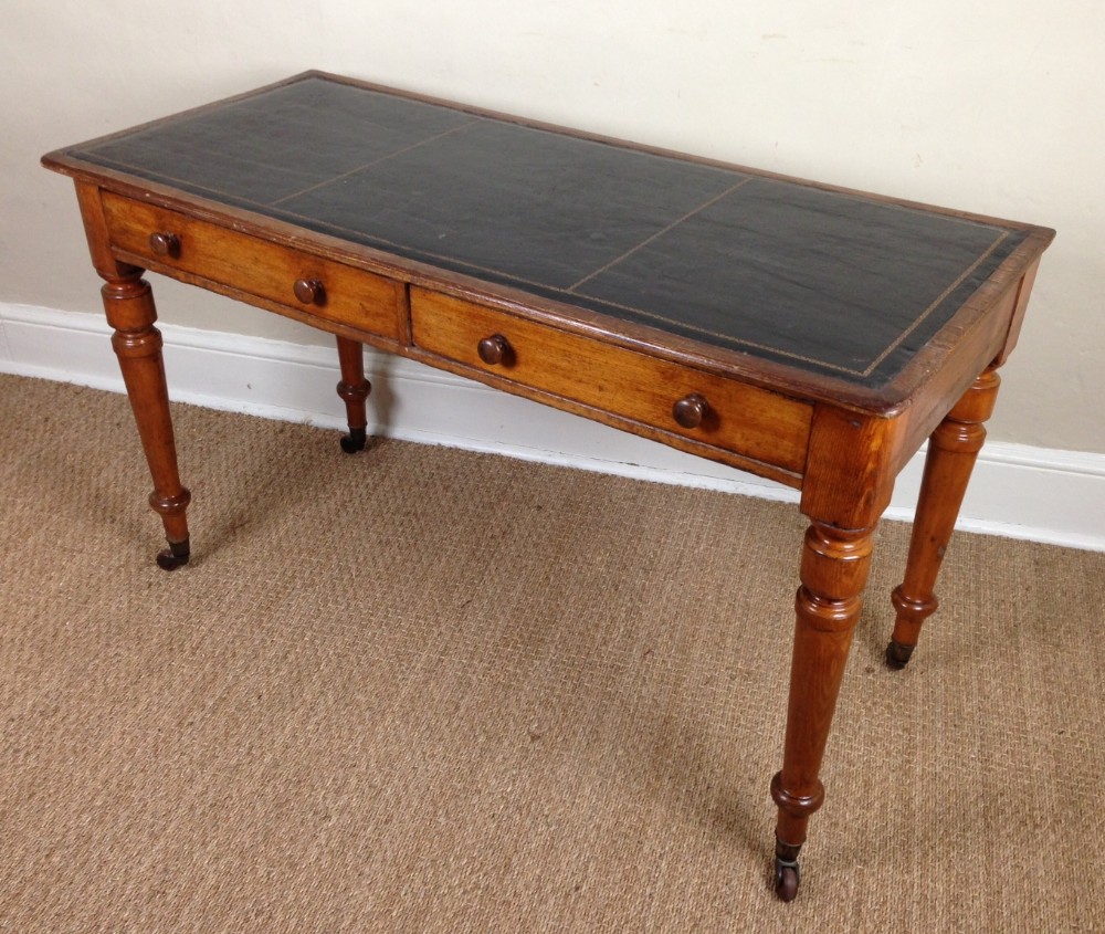 A Victorian ash writing table c 1890