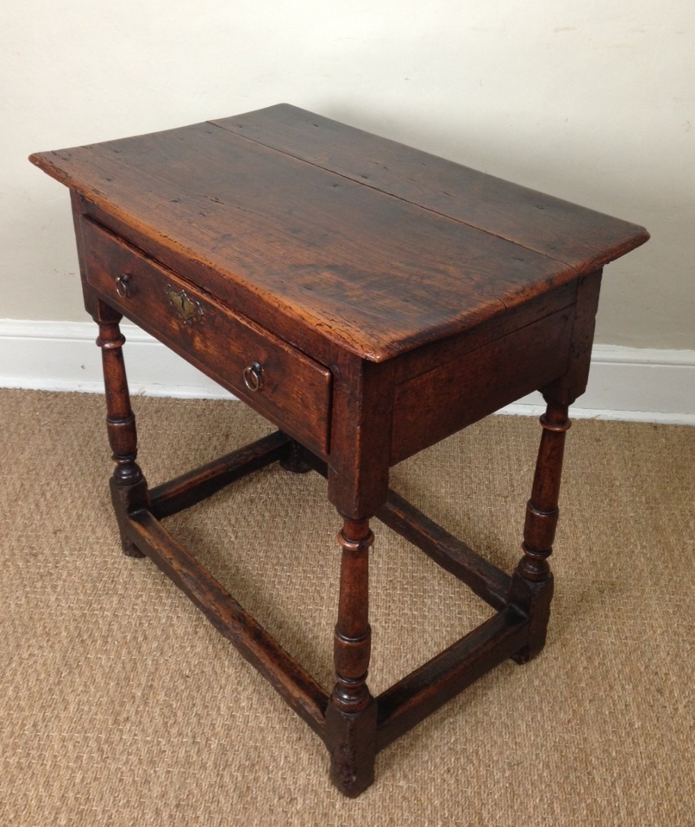 A Queen Anne elm and walnut side table c 1710